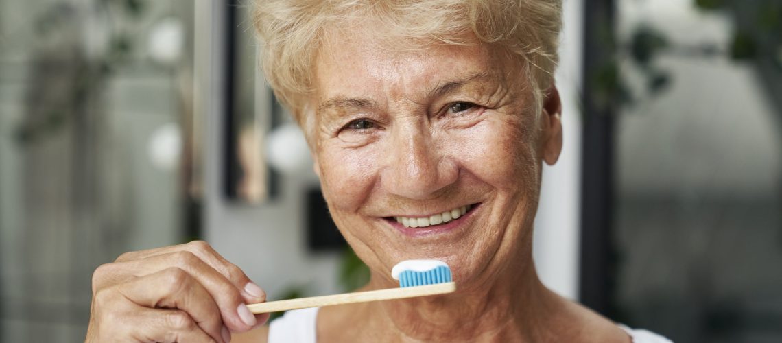 Senior woman about to brush her teeth